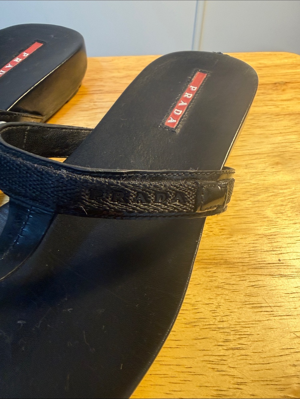 Prada Black Leather Thong Sandals with Red Logo Inset - Picture 3 of 6